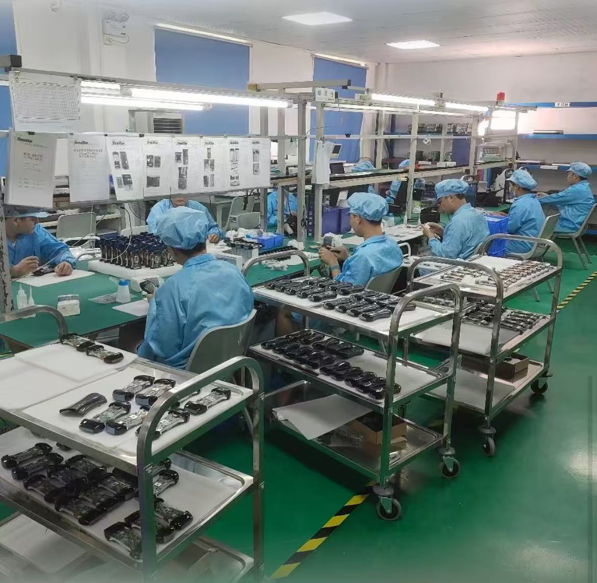 Production line workers assembling medical equipment